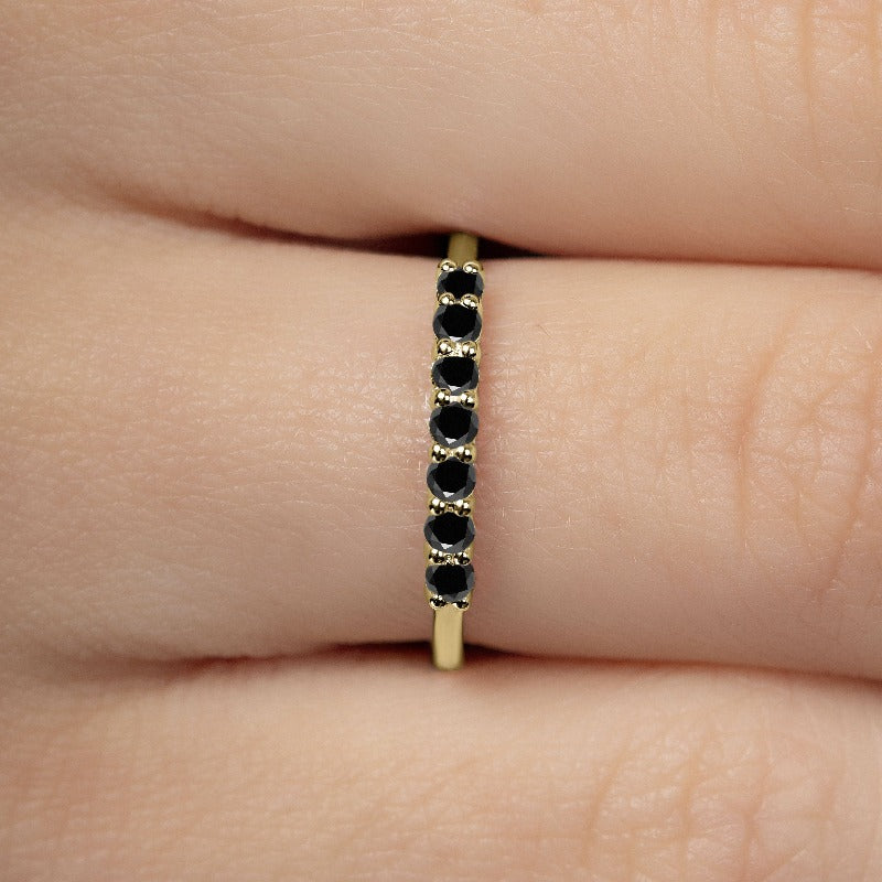 Yellow gold vadha ring set with 7 natural black diamonds