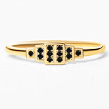 Brami geometric ring in yellow gold set with black diamonds