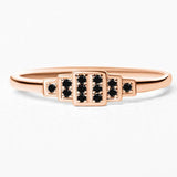 Brami geometric ring in rose gold set with black diamonds
