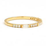 Semi eternity baguette ring with round diamond in 18 ct yellow gold