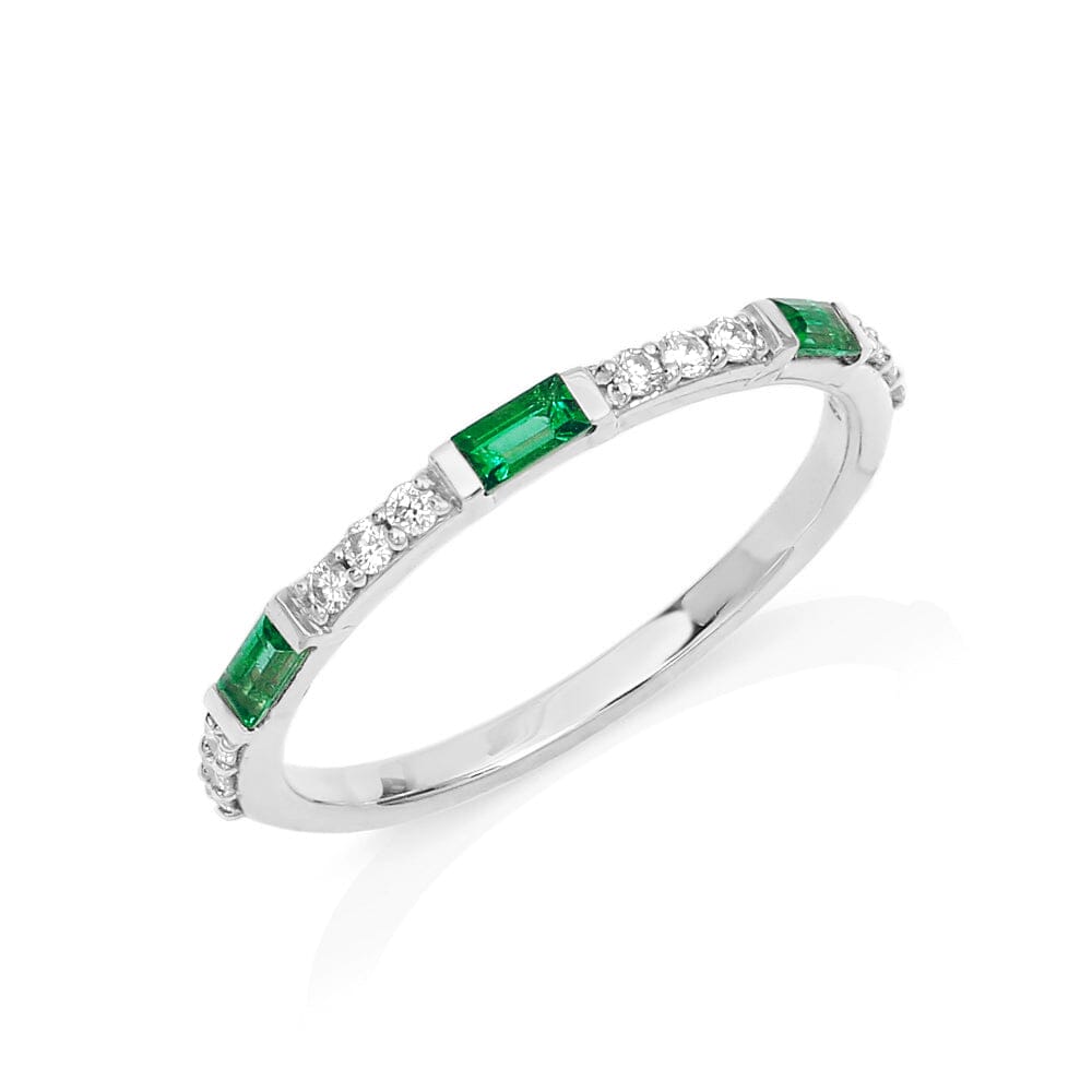 Semi eternity ring with emerald and round diamonds in 18ct white gold