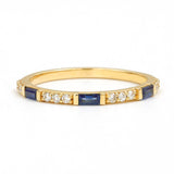 Moksha semi eternity ring with sapphire and round diamond in yellow gold