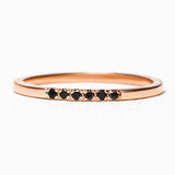 wedding ring in rose gold and black diamonds