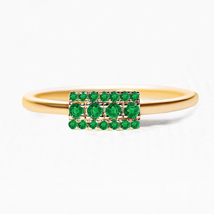 Yellow gold Sapna ring set with emeralds