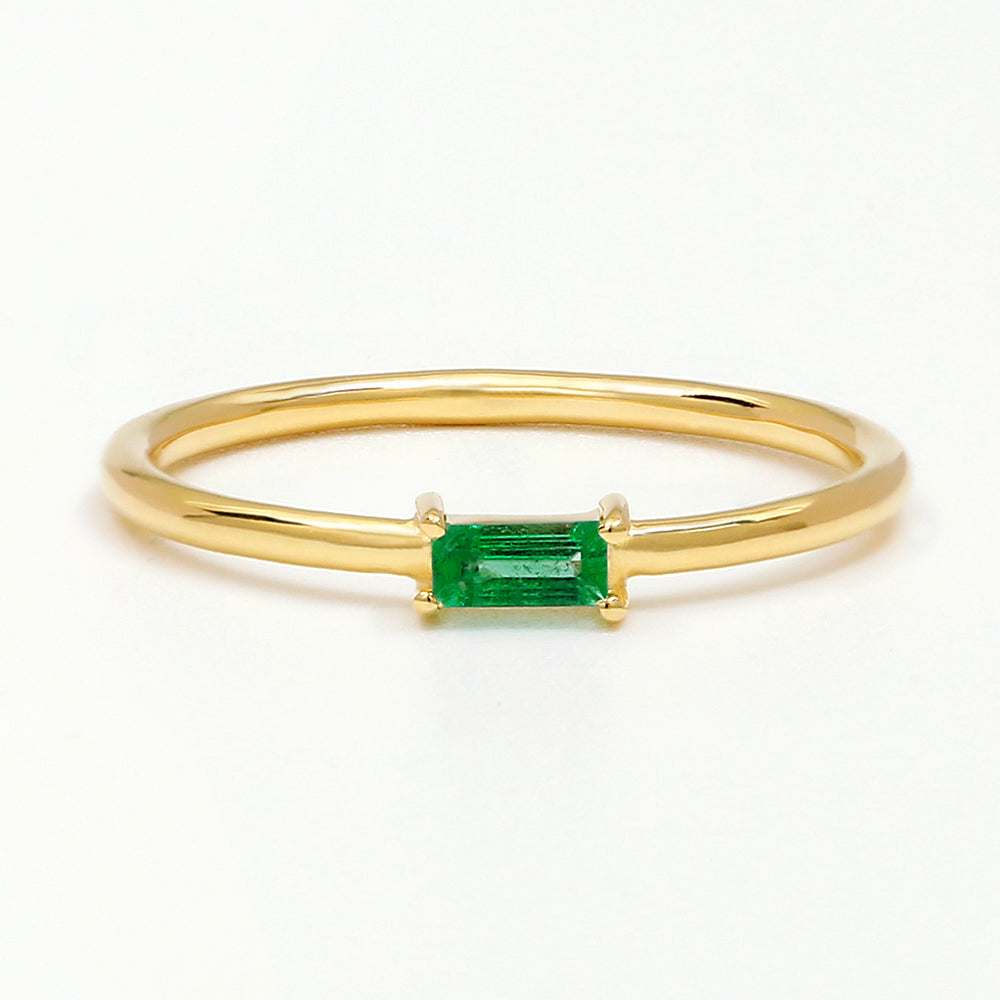 Yellow gold emerald solitaire ring