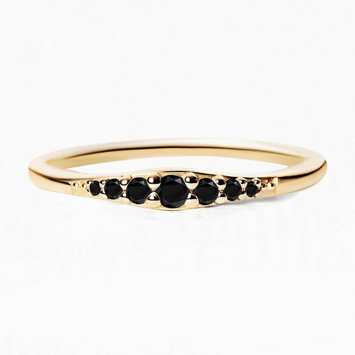 Sushma ring in yellow gold set with 7 black diamonds