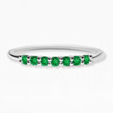 White gold vadha ring set with 7 emeralds