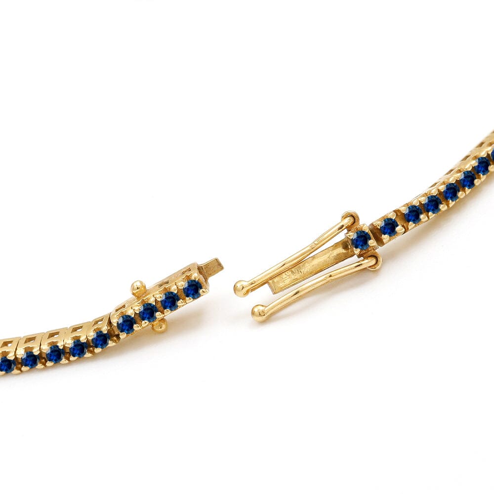 Tennis bracelet Ganga in sapphire and yellow gold 18cts