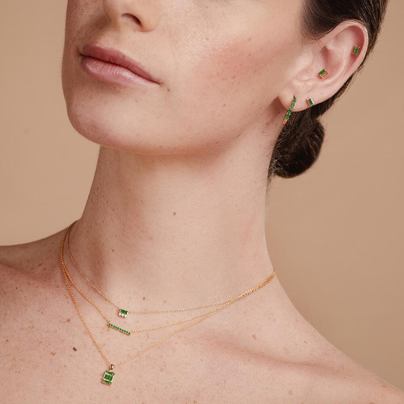 emerald and diamond necklace set in yellow gold