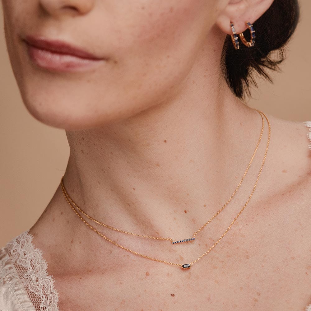 Ujala sapphire bar necklace and shanti sapphire baguette necklace