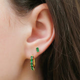Emerald Yatra hoop earrings and emerald Shanti baguette earrings