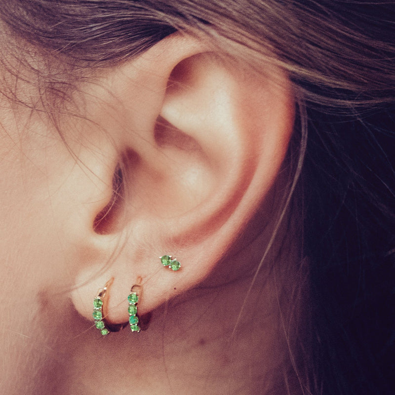 small earrings and emerald hoops